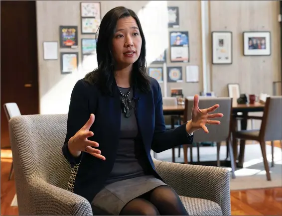  ?? ?? Boston Mayor Michelle Wu speaks with a reporter March 30 in her office at City Hall in Boston.