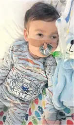  ??  ?? Little Alfie in hospital earlier this month