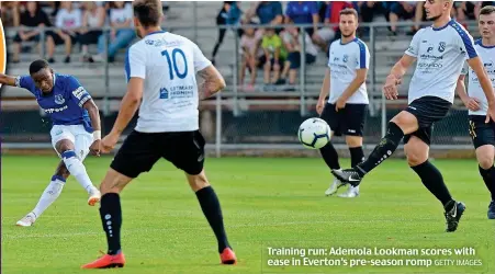  ?? GETTY IMAGES ?? Training run: Ademola Lookman scores with ease in Everton’s pre-season romp