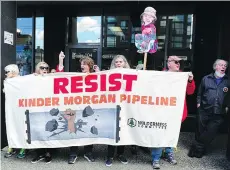  ?? NICKPROCAY­LO ?? Protesters opposed to the Trans Mountain Pipeline expansion rally at Justice Minister Jody Wilson-Raybould’s office in Vancouver on Monday, when demonstrat­ions took place across the country.