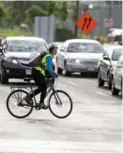  ?? MARCUS OLENIUK/ TORONTO STAR ?? A bike lane along the full length of Bloor-Danforth would give cyclists a much needed east-west thoroughfa­re.