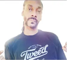  ?? CANOPY GROWTH CORPORATIO­N ?? U.S. rap star Snoop Dogg partners with Tweed, a Canadian cannabis producer. Under a Senate proposal, marijuana-related merchandis­e like Snoop Dogg’s shirt would be illegal.