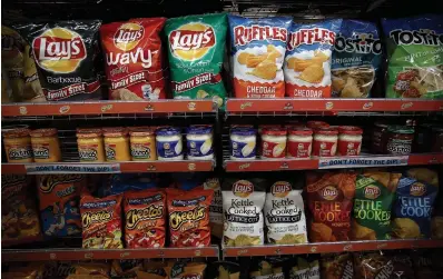  ?? JUSTIN SULLIVAN GETTY IMAGES FILE PHOTO ?? Several retailers have received notice of a 10 to 11 per cent price hike from the snack food conglomera­te Frito-Lay.