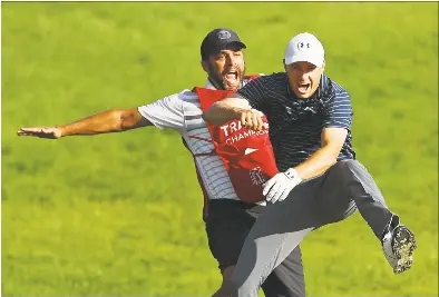  ?? Maddie Meyer / Getty Images ?? Jordan Spieth celebrates with caddie Michael Greller after chipping in for birdie from a bunker on the 18th green to win the Travelers Championsh­ip in a playoff against Daniel Berger on June 25, 2017.