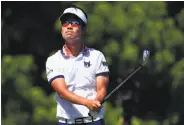  ?? Tom Pennington / Getty Images ?? First-round leader Kevin Na plays his shot from the eighth tee at the Fort Worth Invitation­al.