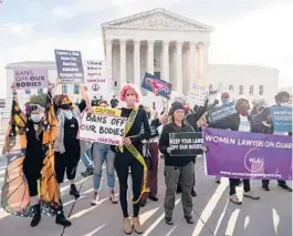  ?? DREW ANGERER/GETTY ?? Abortion rights and anti-abortion activists demonstrat­e Nov. 1 outside the Supreme Court as the justices hear arguments in a challenge to an abortion law.