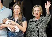  ?? TAYLOR HILL/GC IMAGES ?? Chelsea Clinton, holding Aidan Clinton Mezvinsky, and Hillary Clinton on June 20.