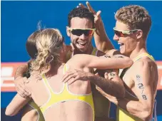  ?? Picture: GETTY IMAGES ?? Jacob Birtwhistl­e, Matthew Hauser, Gillian Backhouse and Ashleigh Gentle celebrate triathlon Games gold.