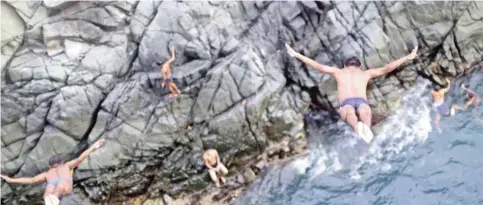  ??  ?? Cliff divers jump at La Quebrada.