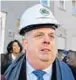  ??  ?? Gov. Larry Hogan watches the demolition of a home in the 1000 block of N. Stricker St.