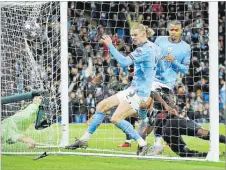  ?? Picture: ACTION IMAGES via REUTERS ?? Manchester City’s Erling Braut Haaland scores their third goal and his hattrick.