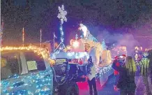  ?? COURTESY OF THE ESPAÑOLA DOWNTOWN ACTION TEAM ?? A grand holiday parade of lights will brighten the streets of Española on Dec. 9 in an event that usually attracts 40 to 50 entrants and thousands of spectators.