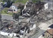  ?? JOHN HART/WISCONSIN STATE JOURNAL VIA AP ?? In a view looking northwest from above, the aftermath of a gas explosion in downtown Sun Prairie, Wis., is seen on Wednesday.