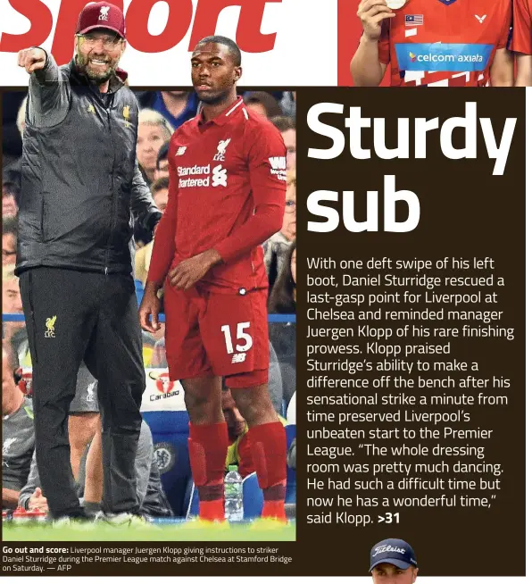  ?? — AFP ?? Go out and score: Liverpool manager Juergen Klopp giving instructio­ns to striker Daniel Sturridge during the Premier League match against Chelsea at Stamford Bridge on Saturday.