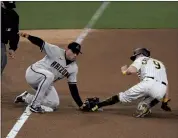  ?? DENIS POROY — THE ASSOCIATED PRESS ?? San Diego’s Jake Cronenwort­h, right, is tagged out by Arizona third baseman Asdrubal Cabrera on an attempted steal during the fourth inning of Friday’s game.