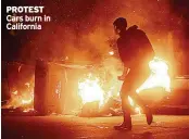  ??  ?? PROTEST Cars burn in California