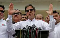  ?? — REUTERS/Athit Perawongme­tha ?? WINNER: Cricket star-turned-politician Imran Khan, chairman of Pakistan Tehreek-e-Insaf (PTI), speaks to members of media after casting his vote at a polling station during the general election in Islamabad, Pakistan, July 25, 2018.