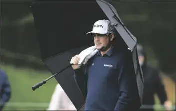  ?? NICK WASS/AP ?? KEEGAN BRADLEY WATCHES BETWEEN SHOTS on the seventh green during the third round of the Wells Fargo Championsh­ip tournament on Saturday at TPC Potomac at Avenel Farm golf club in Potomac, Md.