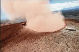  ?? GETTY IMAGES ?? Ash spews from the Puu Oo crater on Hawaii’s Kilauea volcano in Hawaii Volcanoes National Park. The governor declared a local state of emergency after the volcano erupted following a 5.0-magnitude earthquake.