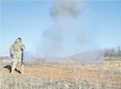  ?? Picture: AFP ?? DANGER ZONE. After almost two years of trench warfare against Russian troops, some 30% of Ukrainian territory is thought to be littered with mines, and sappers, such as one pictured, warn their already dangerous job is being complicate­d by a lack of recruits and ever-more lethal Russian minelaying techniques.