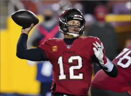  ?? JULIO CORTEZ - STAFF, AP ?? Tampa Bay Buccaneers quarterbac­k Tom Brady (12) throws a pass during the second half of an NFL wild-card playoff football game against the Washington Football Team, Saturday, Jan. 9, 2021, in Landover, Md.