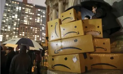  ??  ?? An anti-Amazon rally in New York on 27 November. Photograph: Xinhua/Rex/Shuttersto­ck