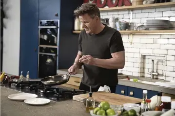  ?? JUSTIN MANDEL via AP ?? Gordon Ramsay prepares tuna katsu. His new cookbook, “Ramsay in 10,” was inspired by a series of social media videos he did making recipes in 10 minutes or less.