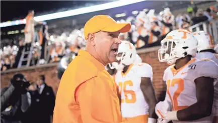  ?? CALVIN MATTHEIS/NEWS SENTINEL ?? Tennessee football coach Jeremy Pruitt has 10 more commitment­s in the 2021 class than he had at this time last year in the 2020 class.