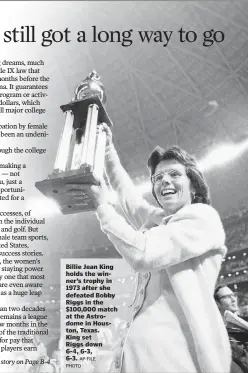  ?? AP FILE PHOTO ?? Billie Jean King holds the winner’s trophy in 1973 after she defeated Bobby Riggs in the $100,000 match at the Astrodome in Houston, Texas. King set Riggs down 6-4, 6-3, 6-3.