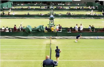  ??  ?? England Lawn Tennis &amp; Croquet Club,Wimbledon in England. General view over the outside courts in this July 3, 2016 file photo. — Reuters photo