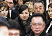  ?? KIM IN-CHUL / YONHAP ?? North Korean singer Hyon Song Wol (center) arrives at the Gangneung Railway Station in Gangneung, South Korea, on Sunday leading Pyongyang’s delegation ahead of next month’s Winter Olympics.