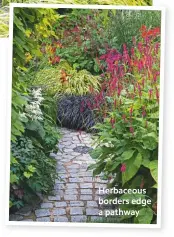  ??  ?? Herbaceous borders edge a pathway