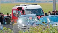  ?? AFP ?? PROMPT ACTION: Police officers stand next to a damaged BMW car near Marquise, northern France, on Wednesday. —