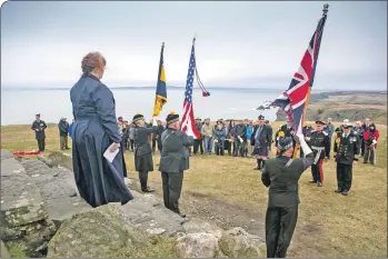  ?? Photograph: Warren Media ?? Rev Dr Karen Campbell led the re-dedication of the American Monument at Mull of Oa.