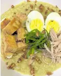  ??  ?? Oatmeal Curry Lugaw with Hard-boiled Egg, Fried Tokwa, Shredded Chicken, Toasted Garlic and Leeks by chef Zemir Herrera-Rollan