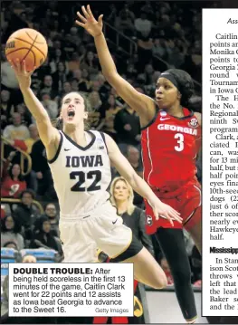  ?? Getty Images ?? DOUBLE TROUBLE: After being held scoreless in the first 13 minutes of the game, Caitlin Clark went for 22 points and 12 assists as Iowa beat Georgia to advance to the Sweet 16.