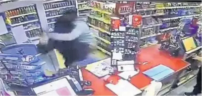  ??  ?? ●●The knifeman is tackled by one of the shop customers