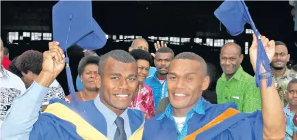  ?? Photo: Ronald Kumar ?? Brothers Tevita Galu (left) and Inosi Naivi celebrate their graduation from Fiji National University at Vodafone Arena on December 13, 2017.
