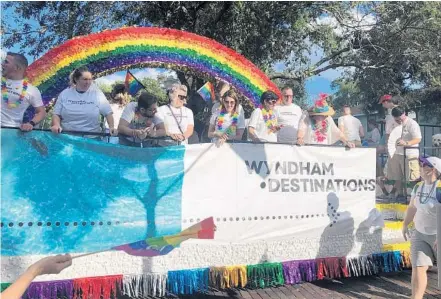  ?? ANNIE MARTIN/COURTESY ?? Wyndham Destinatio­ns employees participat­e in Orlando’s Most Colorful Parade. Wyndham is the biggest timeshare company in the world.