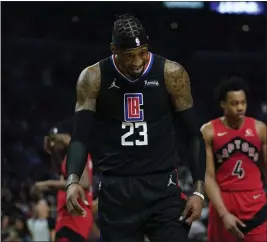  ?? ASHLEY LANDIS — THE ASSOCIATED PRESS ?? Clippers forward Robert Covington reacts to a foul call during the second half against the Toronto Raptors in Los Angeles on Wednesday. The Clippers were edged 103-100.