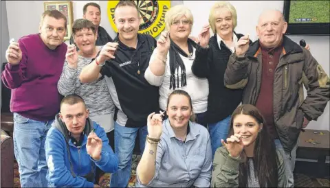  ??  ?? Players at the charity darts match held at the Mill pub, Canterbury, in aid of the funeral appeal for Sabrina Jones, right,