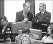  ?? THE ASSOCIATED PRESS ?? Illinois House Speaker Michael Madigan (left) and Senate President John Cullerton confer Tuesday on the Senate floor at the state Capitol in Springfiel­d.