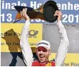  ?? FOTO: DPA ?? René Rast mit der Titel-Trophäe der DTM.