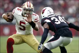  ?? RALPH FRESO — THE ASSOCIATED PRESS ?? The biggest question going forward for the Niners is whether Trey Lance showed enough in a half against Seattle and a loss at Arizona on Sunday to change the timeline of when he will take over for Jimmy Garoppolo.