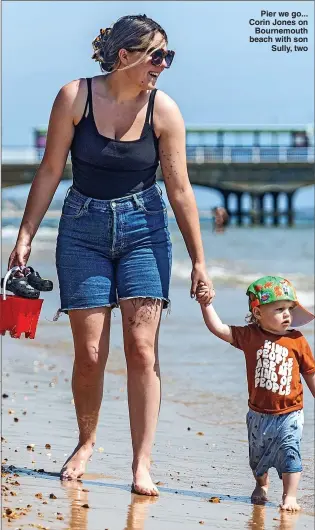  ?? ?? Pier we go... Corin Jones on Bournemout­h beach with son Sully, two