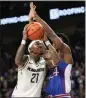  ?? JOHN RAOUX — AP ?? UCF's C.J. Walker goes up for a shot against K.J. Adams Jr. of Kansas.