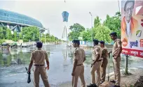  ?? ?? Policemen stand guard outside an airport, ahead of the return of rebel Shiv Sena MLAs from Goa, in Mumbai on Saturday