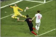  ?? THANASSIS STAVRAKIS — THE ASSOCIATED PRESS ?? Croatia’s Mario Mandzukic, 2nd right, scores his side’s second goal during the semifinal match between Croatia and England at the 2018 soccer World Cup in the Luzhniki Stadium in Moscow, Russia Wednesday.