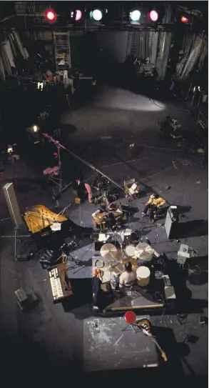  ?? PHOTO BY ETHAN A. RUSSELL ?? An overhead angle of the Beatles at work at Twickenham Film Studios in 1969.