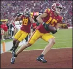  ?? Associated Press ?? USC wide receiver Drake London (15) celebrates his touchdown catch during the first half against Utah on Oct. 9 in Los Angeles. The Trojans play at No. 13 Notre Dame today.